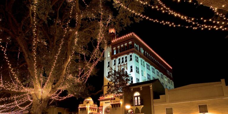 Historic district of St. Augustine illuminated by millions of white holiday lights.